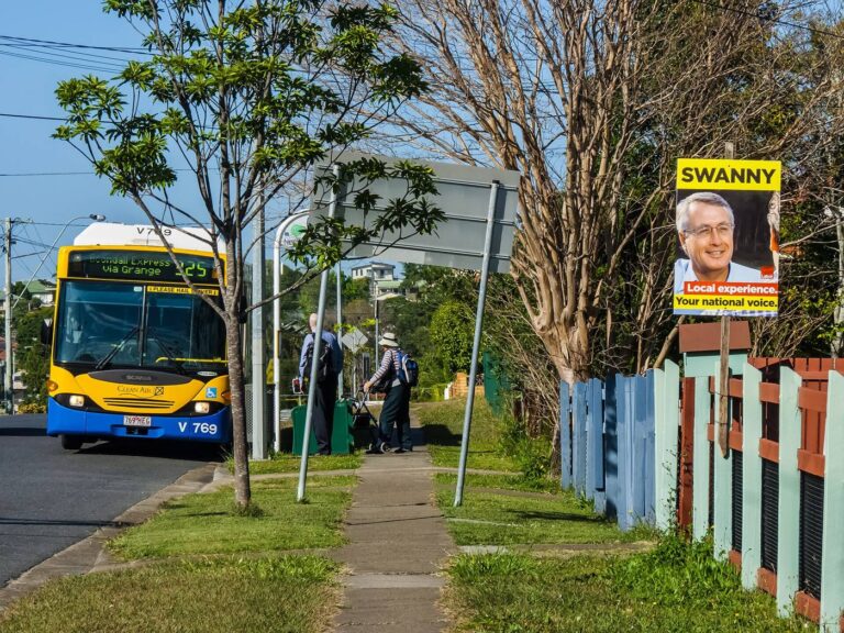 Electric Buses Go Mainstream in City Fleets A city bus pulling in at a suburban bus stop