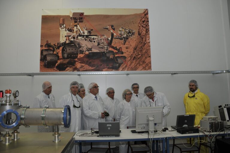 Inside the $21 Billion Plan to Expand Chipmaking in Upstate New York Cleanroom engineer working on semiconductor wafers at a chip factory